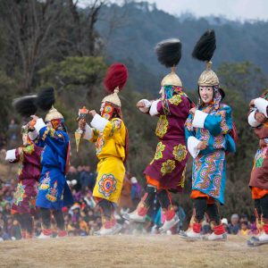 THIMPHU, BHUTAN - DECEMBER 13: Dancers with tradition mask dance at yearly festival called Tshechu Festival on December 13, 2012 in Bhutan